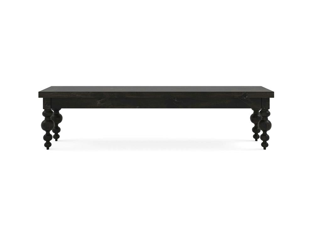 The Olivia Bench by James+James features a rectangular seat in Charred Ember on Alder and four ornately turned legs, shown against a plain white background.