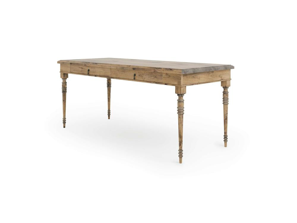 The Audrey Desk - Harvest Wheat by James+James is a rectangular wooden table with four decorative, turned legs. This desk features a natural wood finish and a minimalistic design, exuding a rustic yet elegant appearance.