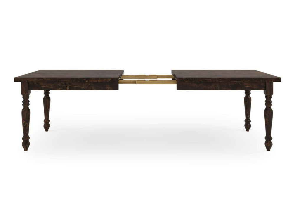 The French Country Expandable Dining Table - Tobacco by James+James features ornately carved legs, shown in a partially extended state with a visible middle section designed for inserting an additional leaf. The table boasts a dark finish and is styled in a traditional design.