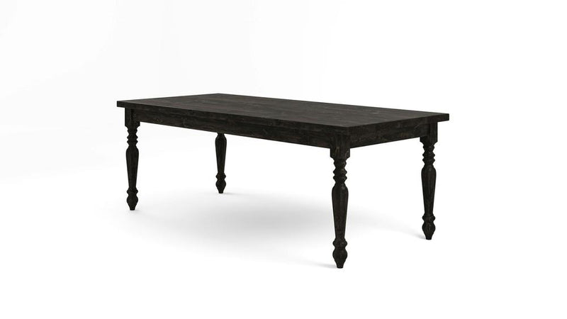 A French Country Dining Table - Charred Ember from James+James, featuring a rectangular top and four turned legs, sits against a plain white background. The black wooden table boasts a rustic design with a distressed finish, evoking a vintage or farmhouse style.