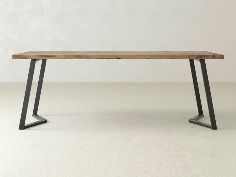 The Arkwright Desk - Harvest Wheat from James+James features a smooth wooden surface with natural grain patterns and a prominent knot in the upper center area. The light brown wood has subtle tone variations, enhancing its organic and rustic charm.