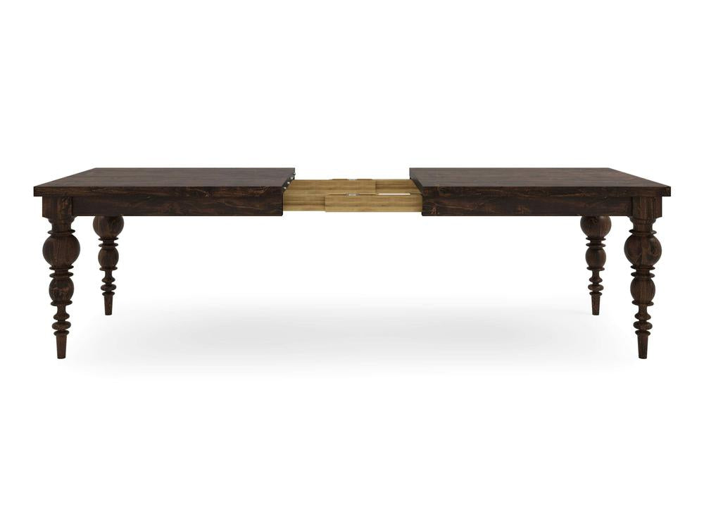 The Bailey Expandable Dining Table - Tobacco by James+James features a dark wooden finish and ornate, carved legs. Shown in an extended position, it includes a lighter wood extension leaf in the middle. Boasting a vintage design with a rectangular top and tapered legs, the extension mechanism is partially visible.
