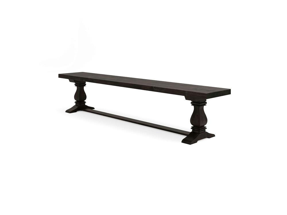 The James+James Heirloom Bench in Charred Ember on Alder features a long, dark wood flat seat with two ornate, turned legs and a horizontal support bar, displayed against a plain white background.